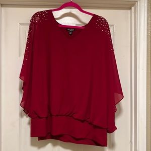 Beautiful cranberry red, cold shoulder, dress barn top.